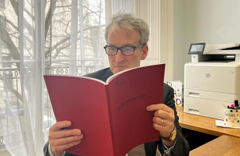 Image of Damian reading the spring budget document
